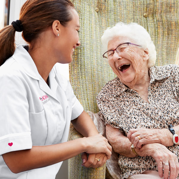 older person with caretaker outside